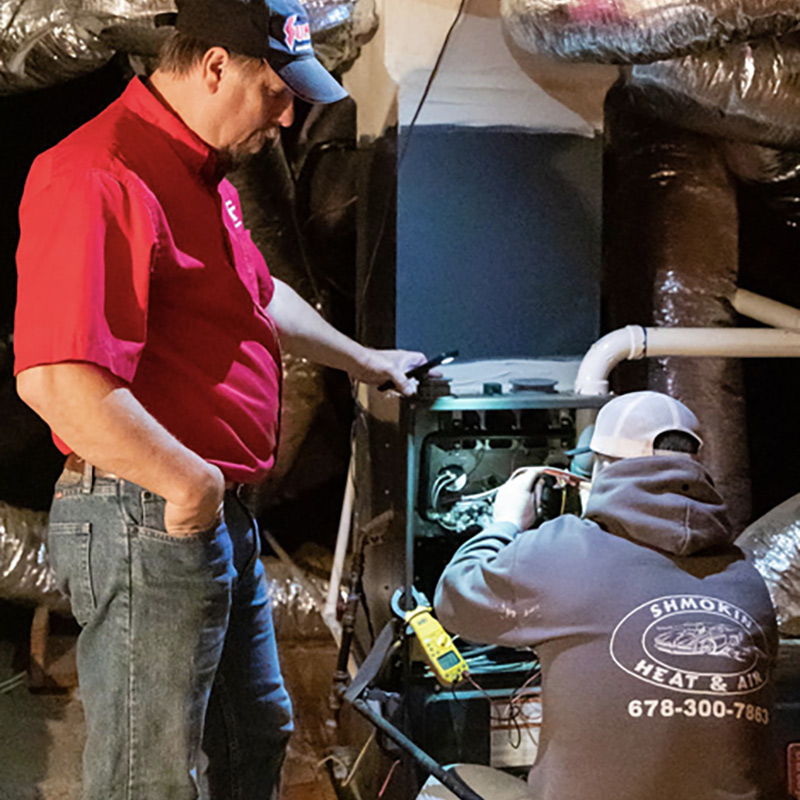 technicians fixing water heater griffin ga