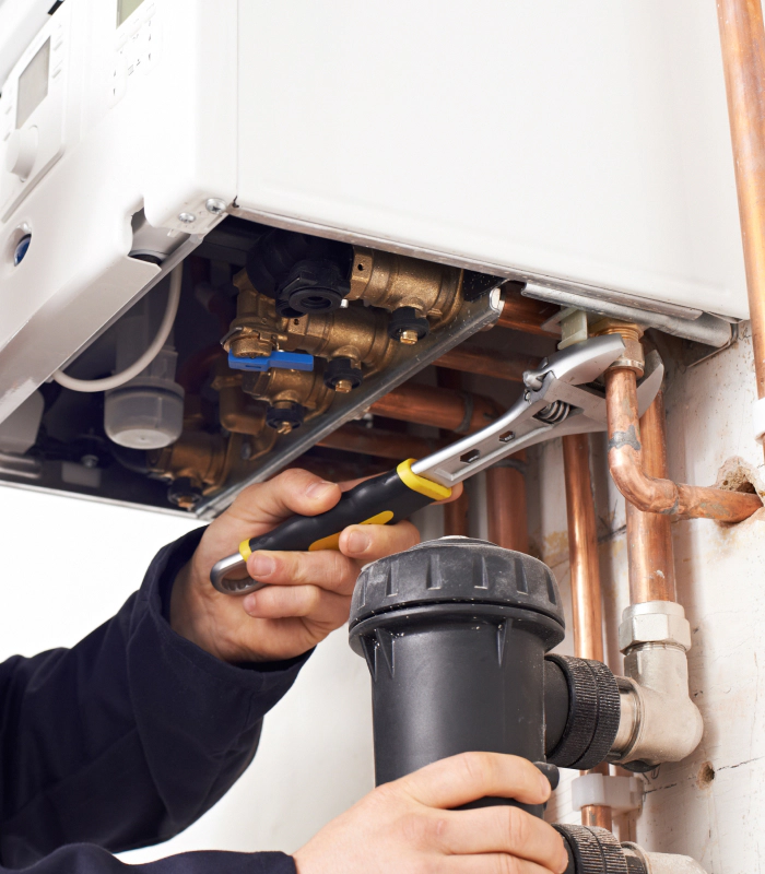 technician doing a heating boiler repair stockbridge ga